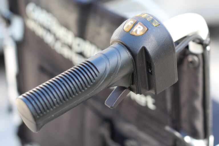 caregiver powered mobility chair - handle trigger closeup